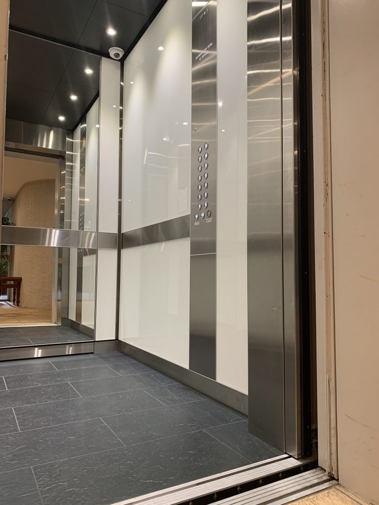 Electra Lift Interior, white and mirror interior, elevator