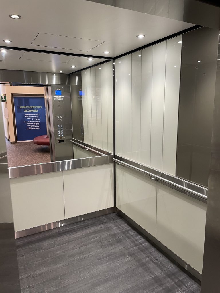 White glass lift interior, Electra Lift Interior